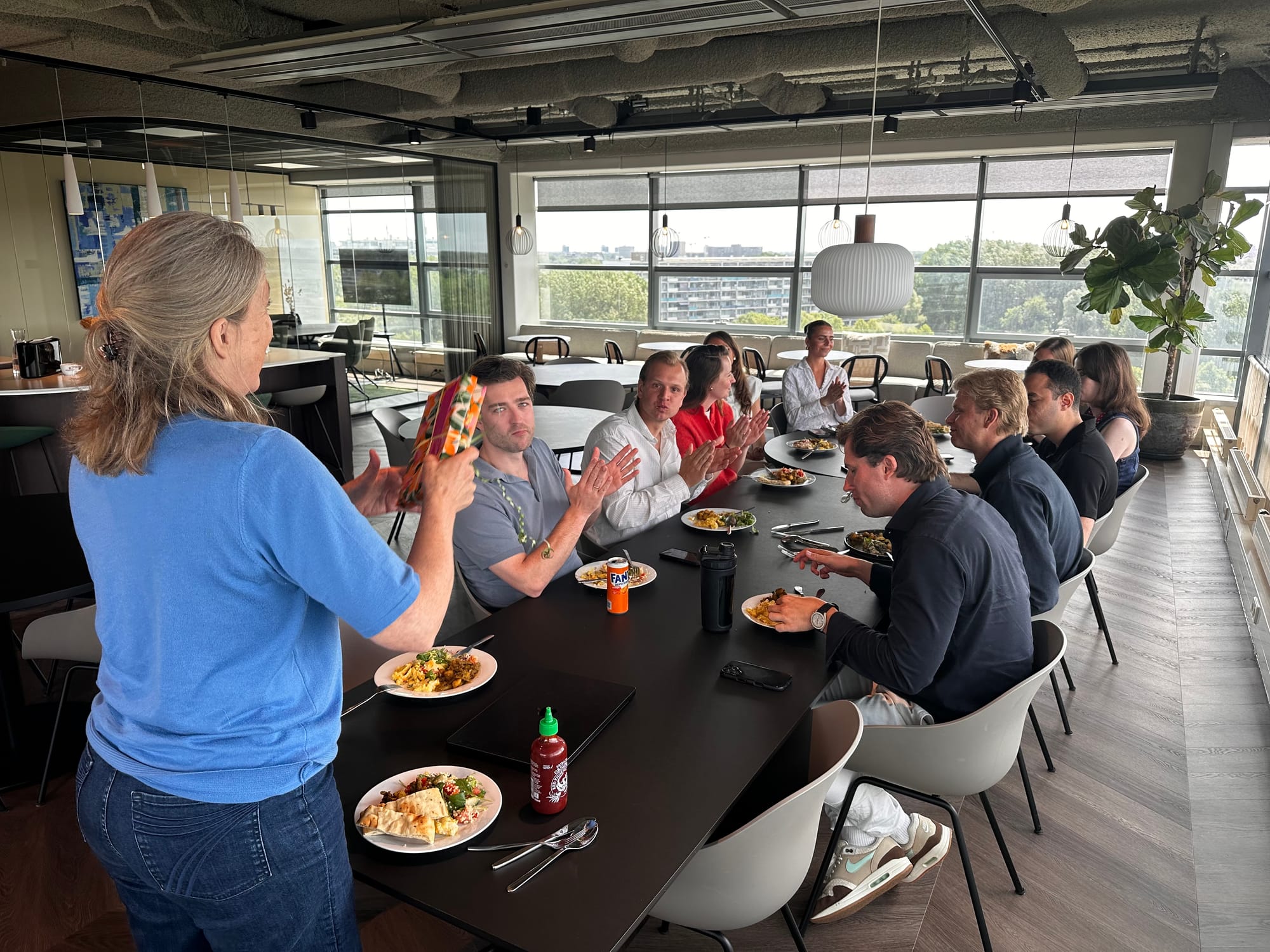 The whole team eating together at one long table
