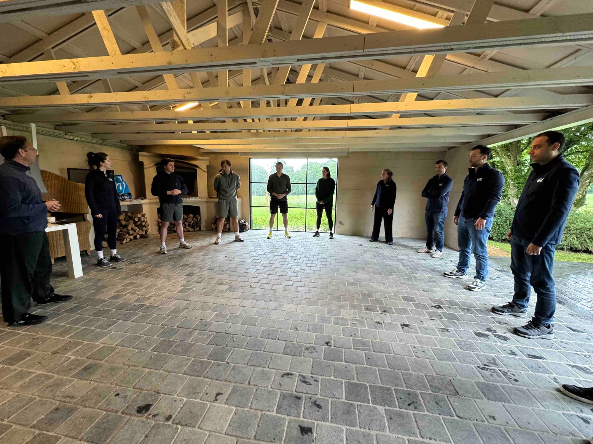 The team gathered in a circle for tai chi at the off-site